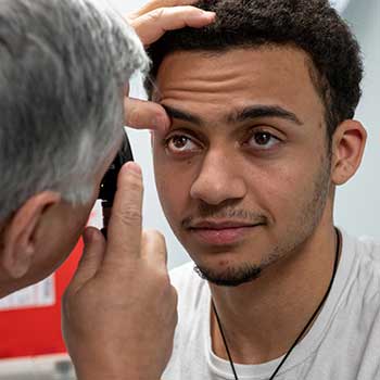doctor checking an eye of a patient